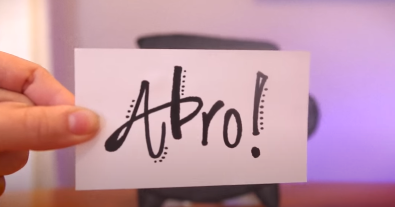 The phrase 'ABRO' written on a piece of paper