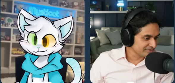 Cartoon cat Mysticat is interviewed live on YouTube stream by a human interviewer wearing headphones and speaking into a mic