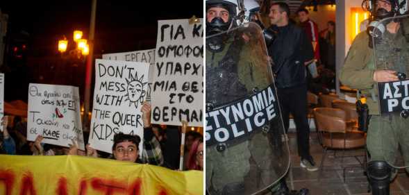People holding up banners in Greek and two Greek police officers