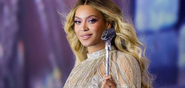 Beyoncé in a silver outfit while performing on the Renaissance tour.