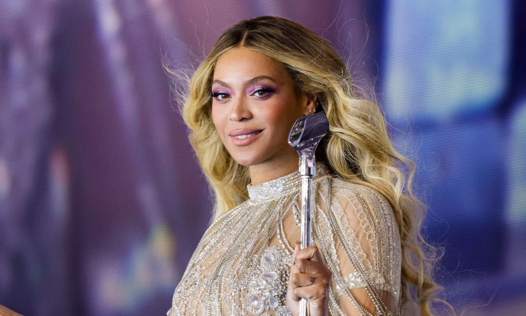 Beyoncé in a silver outfit while performing on the Renaissance tour.