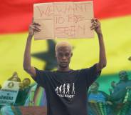 A graphic composed of the red, yellow and green flag of Ghana; people protesting against an anti-LGBTQ+ bill proposed by Ghanaian lawmakers; and a Ghanaian queer activist holding up a sign reading 'We want to be seen'