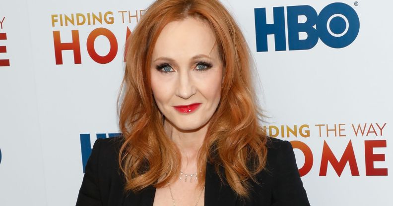 Harry Potter author JK Rowling looks towards the camera while wearing a black blazer at a press event