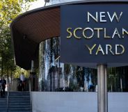 A picture of the New Scotland Yard sign outside the Metropolitan Police station in London