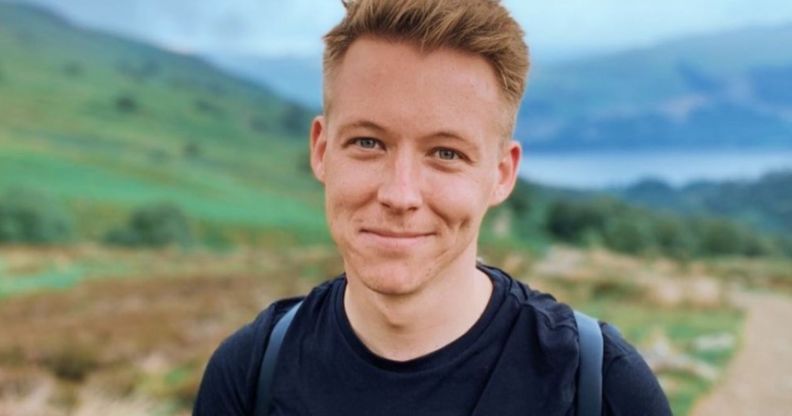 A picture of late BBC Scotland presenter and author Nick Sheridan wearing a black shirt and backpack while walking around outside