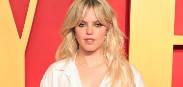 Reneé Rapp in a white dress.