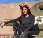 Blaire White sat on a green tank