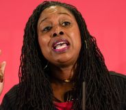 Dawn Butler with a raised finger gives a speech at a conference.
