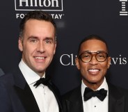 Tim Malone and Don Lemon smiling on a red carpet
