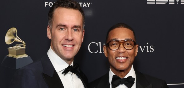 Tim Malone and Don Lemon smiling on a red carpet