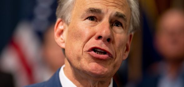 Greg Abott speaking at a legislative session.