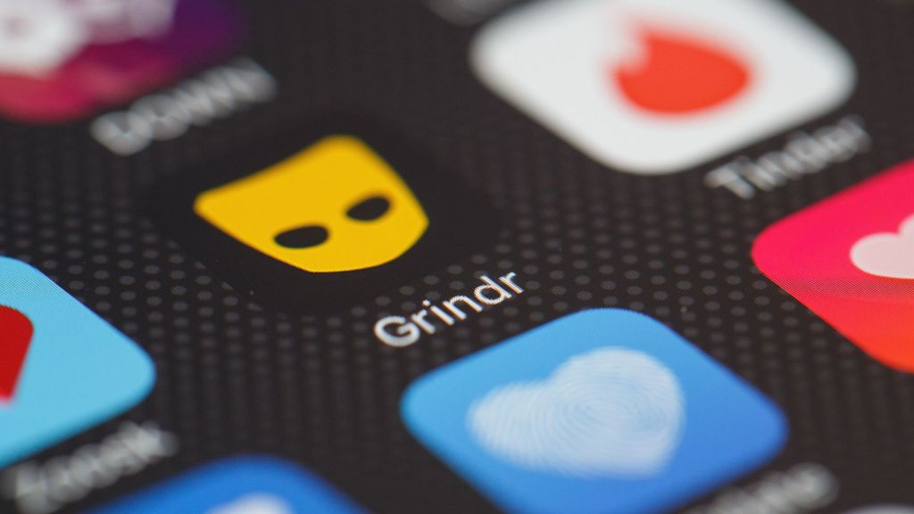 Image of the Grindr app logo on a phone