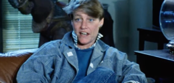 A lesbian woman in a denim jacket in 1980s archive footage