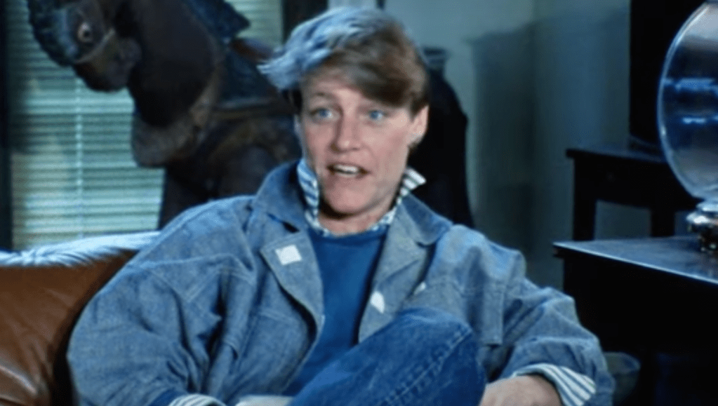 A lesbian woman in a denim jacket in 1980s archive footage