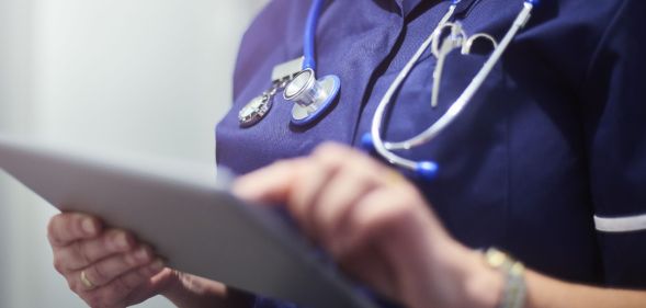 A doctor on a tablet.