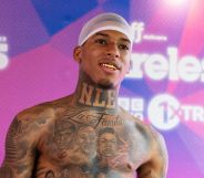 Rapper NLE Choppa smiles while topless at Wireless festival.