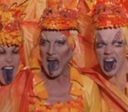 The main trio of Priscilla Queen of the Desert, sticking their tongues out during a performance in drag.