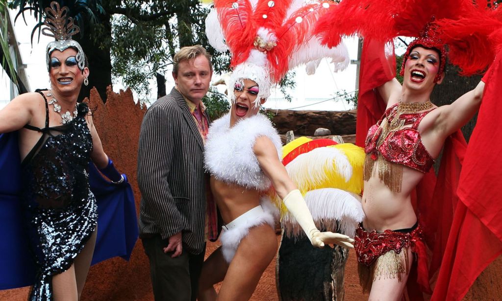 Director Stephen Elliott alongside drag queens dressed as the members of Priscilla, Queen of the Desert.