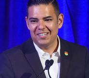 Robert Garcia, in a suit, speaking at an event.
