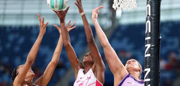 A group of women playing netball