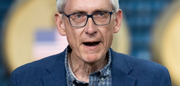 Tony Evers speaking at a political rally.