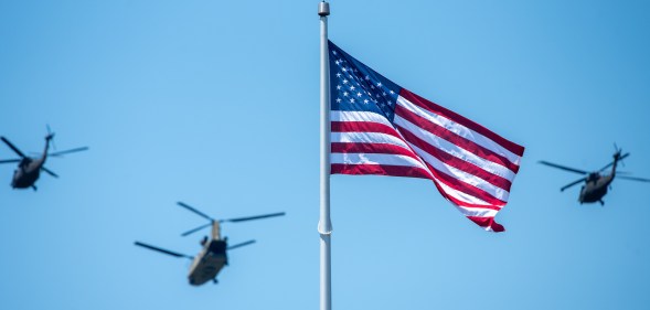 EAST HARTFORD, CT - MAY 30: An American flag waves in the wind as the Connecticut Army National Guard Aviation Unit fly one CH-47 Chinook and two UH-60 Blackhawks for a flyover during the performing of the national anthem prior to the NCAA Division I Men's Lacrosse Championship game between the Cornell Big Red and Maryland Terrapins on May 30, 2022, at Rentschler Field at Pratt & Whitney Stadium in East Hartford, Connecticut. (Photo by Erica Denhoff/Icon Sportswire via Getty Images)