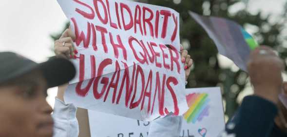 Protesters waves placards while joining supporters of the LBTQ community as they stage a protest against a planned lecture by Kenyan academic Patrik Lumumba (not visible) at the University of Cape Town on July 24, 2023. Lumumba, who has been invited to address a keynote speech by the South African opposition party Economic Freedom Fighters, has been contested because of his views on homosexuality and his support for Uganda's anti-homosexuality bill. (Photo by RODGER BOSCH / AFP) (Photo by RODGER BOSCH/AFP via Getty Images)