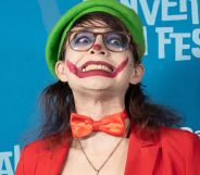 The People's Joker star Vera Drew on the red carpet wearing a joker costume.