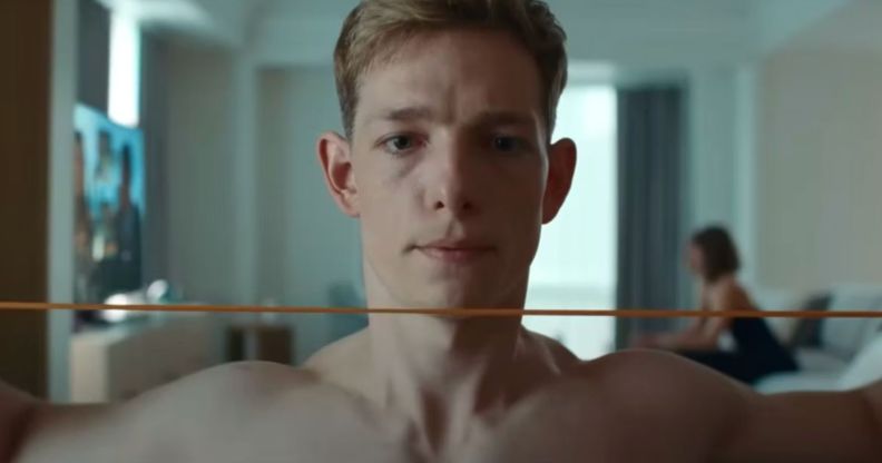 Mike Faist shirtless in a still from Challengers. He looks solemn.