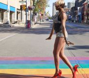 drag queen walking on the crosswalk