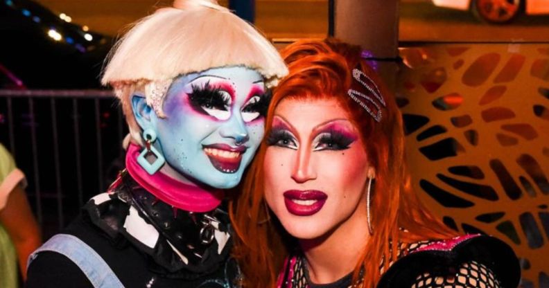 A photo of Drag Race season 16 contestants Dawn and Amanda Tori Meating in drag smiling.