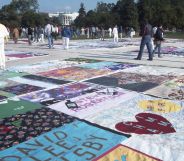 Visitors to the AIDS Quilt Project as it is displayed on the National Mall, Washington DC on 11 October 1996