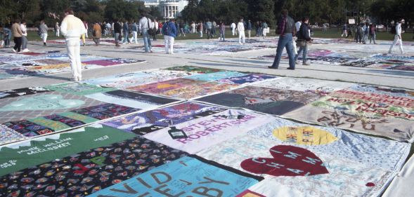 Visitors to the AIDS Quilt Project as it is displayed on the National Mall, Washington DC on 11 October 1996