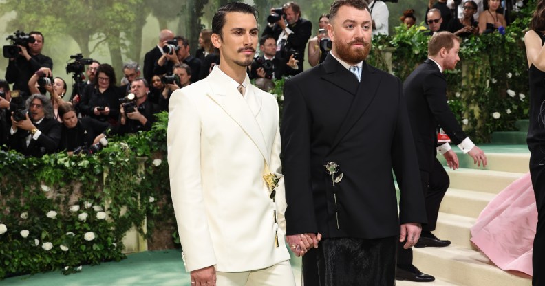 Sam Smith (right) wore a design by partner Christian Cowan (left). (Getty)