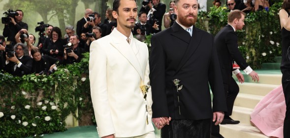 Sam Smith (right) wore a design by partner Christian Cowan (left). (Getty)