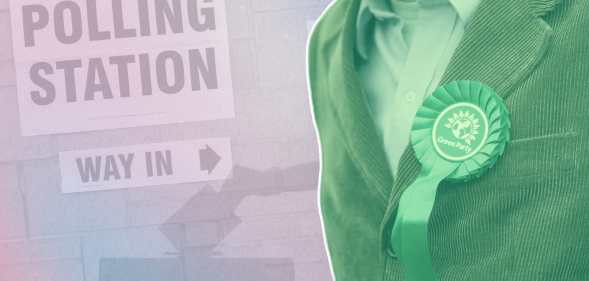 A Green Party candidate next to a polling sign