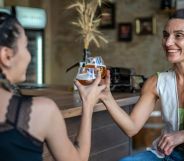 Stock image of two women at a lesbian bar