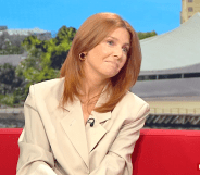 Stacey Dooley on BBC Breakfast, she's wearing a white blazer and sitting on a red sofa
