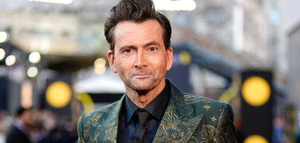 Doctor Who star David Tennant smiles on the red carpet at the 2024 BAFTA Awards.