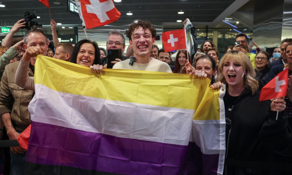 Eurovision winner Nemo poses with a non-binary flag.