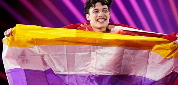 Eurovision Song Contest winner Nemo with their non-binary flag.