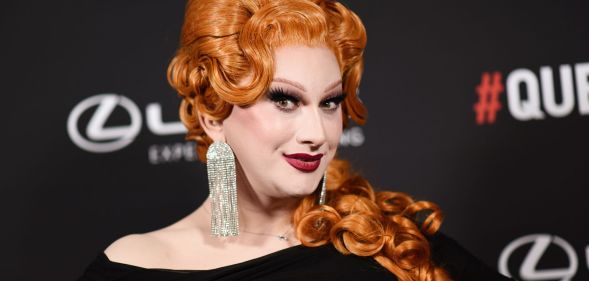 Jinkx Monsoon looks to the left and smiles.