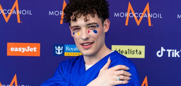 Eurovision star and Switzerland's entrant Nemo poses on the red carpet.