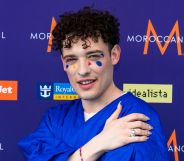 Eurovision star and Switzerland's entrant Nemo poses on the red carpet.