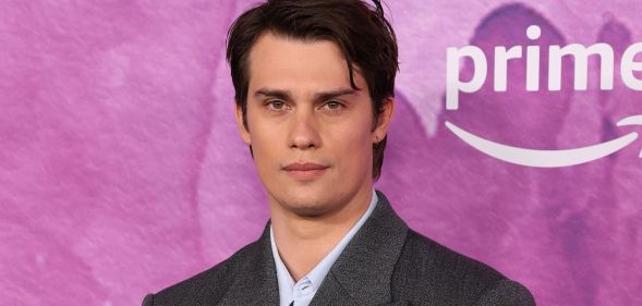 Nicholas Galitzine poses on the red carpet at the Idea of You launch.