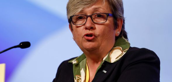 Joanna Cherry speaking into a microphone.