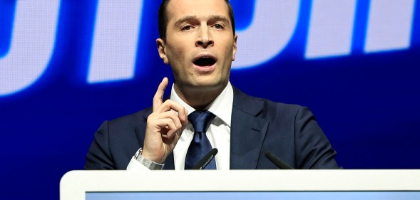 French far-right Rassemblement National (National Rally) RN party's President and lead MEP Jordan Bardella delivers a speech during a meeting in Nice, southern France, on October 6, 2024. (Photo by Valery HACHE / AFP)