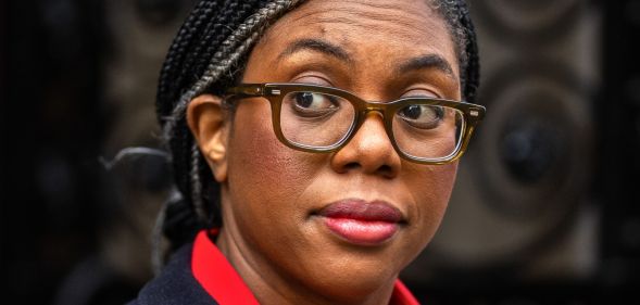 Kemi Badenoch walking past Number 10 Downing Street.