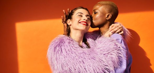 Bright, colourful image of an LGBTQ+ couple