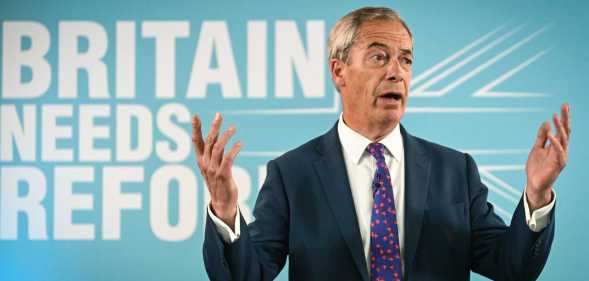Leader of Reform UK Nigel Farage delivers a speech to launch the hard-right party's general election manifesto in Merthyr Tydfil, south Wales, on June 17, 2024, in the build-up to the UK general election on July 4. (Photo by JUSTIN TALLIS / AFP) (Photo by JUSTIN TALLIS/AFP via Getty Images)